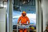 A fisherman on a fishing boat at sea
