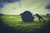 pushing back hay bale field