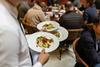 waiter serving food restaurant