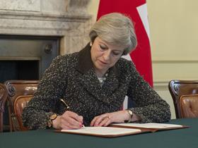 UK prime minister Theresa May signs the letter triggering Article 50