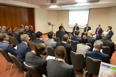 The panel discusses currency and technology at the IPE Conference in Prague