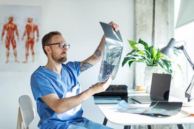 medial specialist radiologist checking a scan