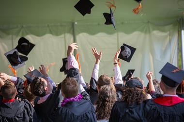 graduation university hats crowd