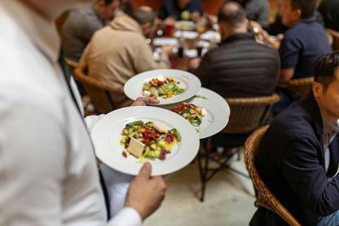waiter serving food restaurant
