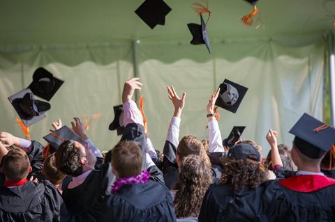 graduation university hats crowd